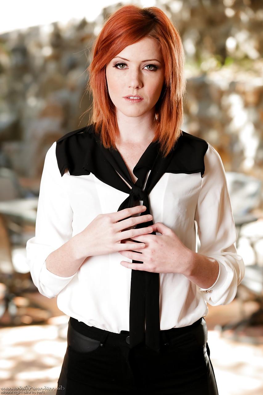 15P Gorgeous redhead stunner Elle Alexandra strips down sensually