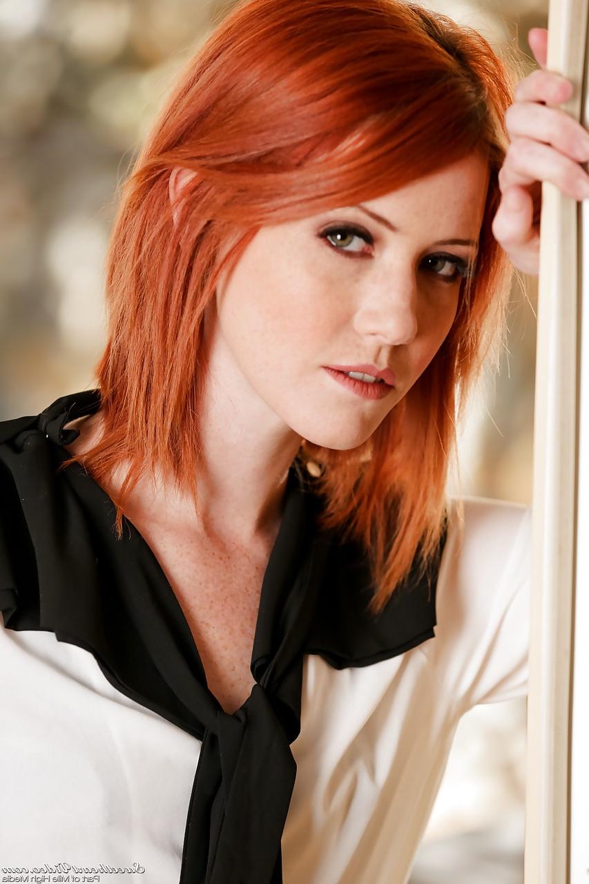 15P Gorgeous redhead stunner Elle Alexandra strips down sensually