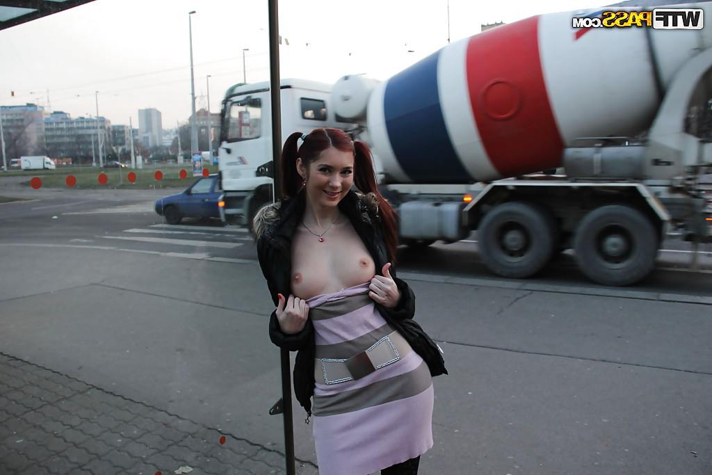 14P Playful redhead babe flashing her shapely titties in a public place