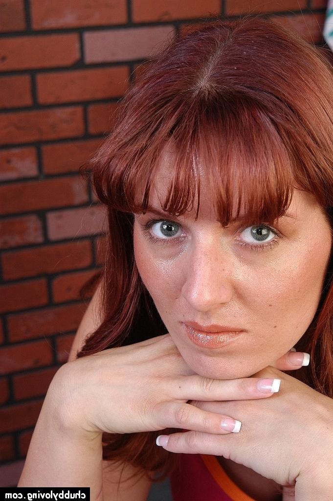 16P Overweight redhead Tru undressing on weight lifting bench to pose nude