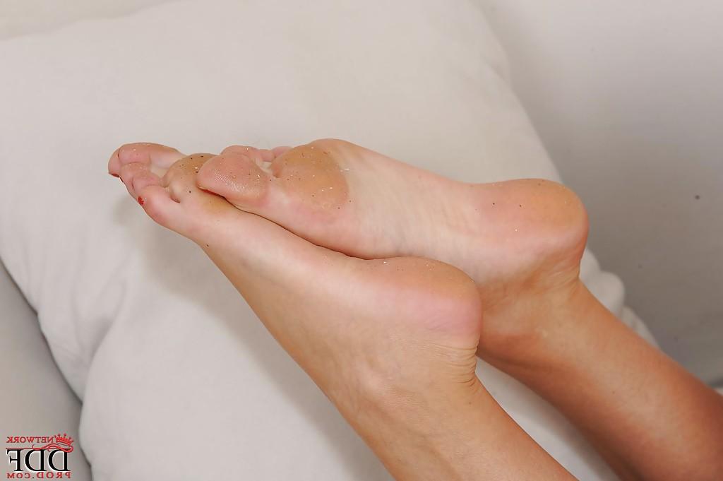 16P Slender brunette sweetie undressing and exposing her sexy soles