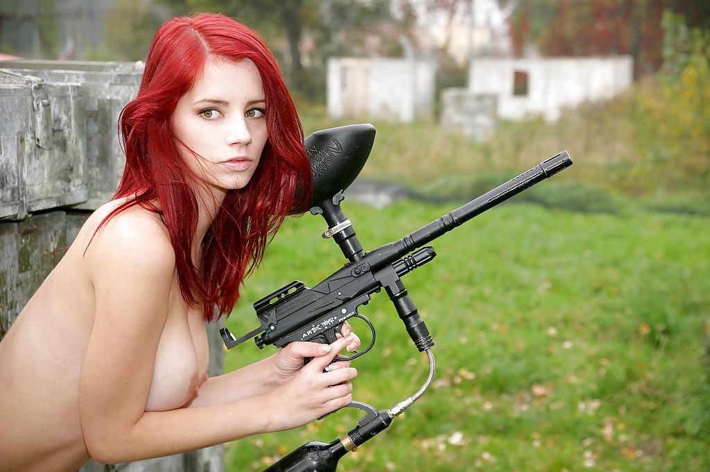 16P Stunning teen redhead Piper posing naked with a paintball gun