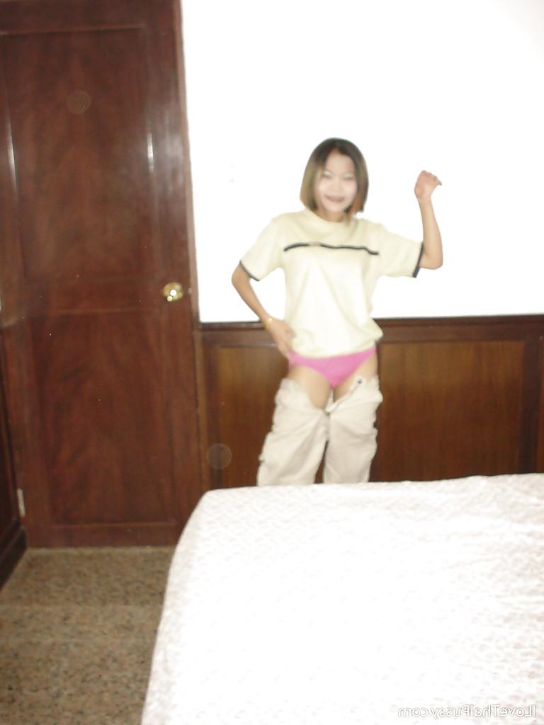 16P Seductive asian teen with tiny tits babe taking a shower and posing naked