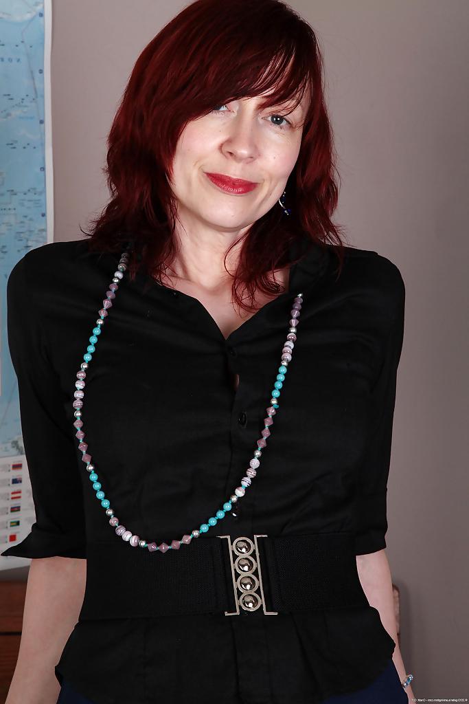 16P Redhead mature teacher undressing and exposing her goods in the classroom