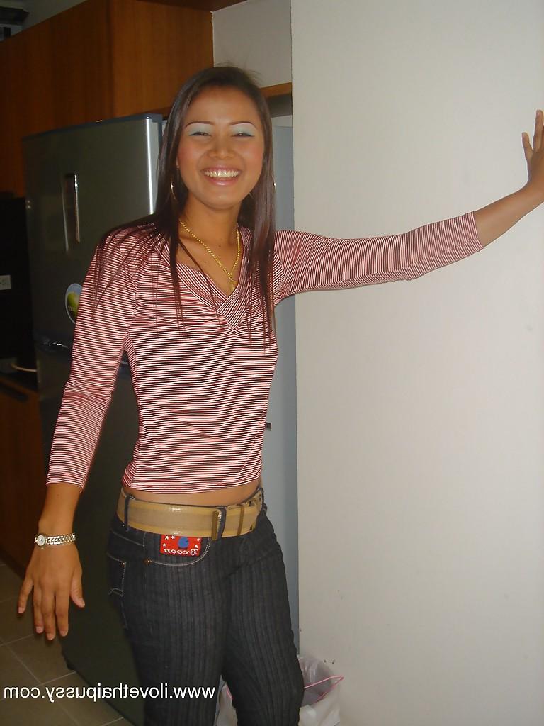 16P Seductive asian babe stripping off her clothes and spreading her legs