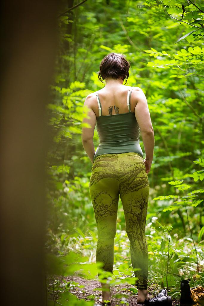 16P Voyeur snaps of naked brunette chick in glasses getting dressed in woods