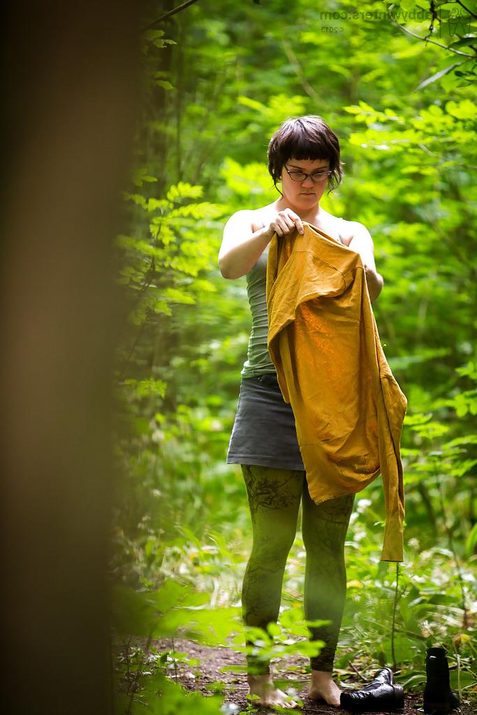16P Voyeur snaps of naked brunette chick in glasses getting dressed in woods