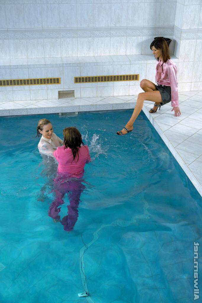 16P Fully clothed fetish ladies having some wet fun in the pool
