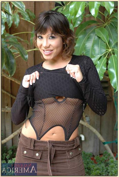 16P Asian mature Ava Devine flaunting in black gauzy lingerie and stockings
