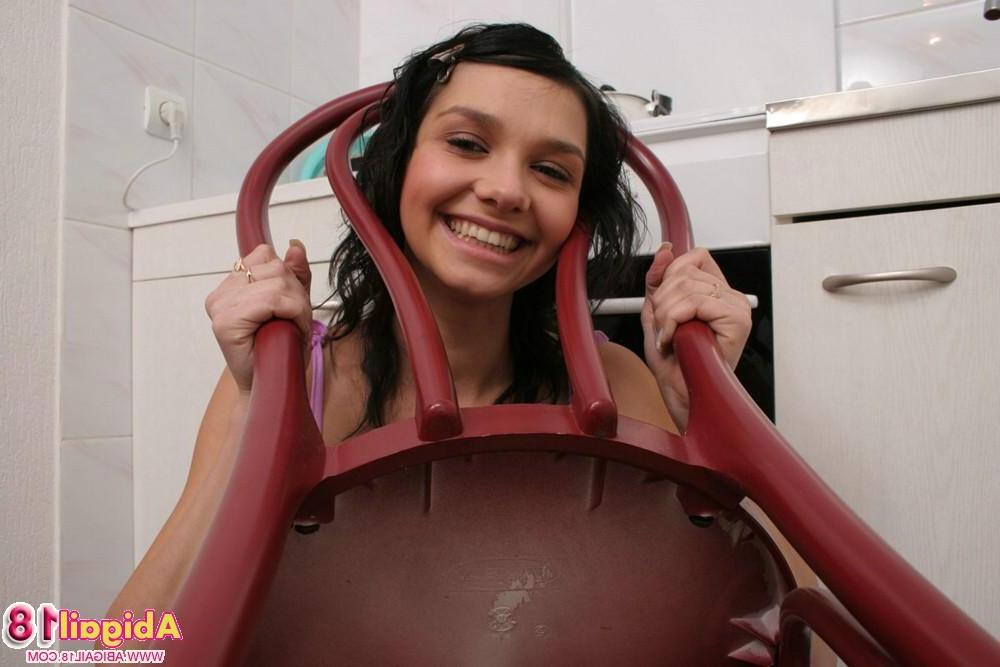 15P Cutie Abigail flirts in the kitchen