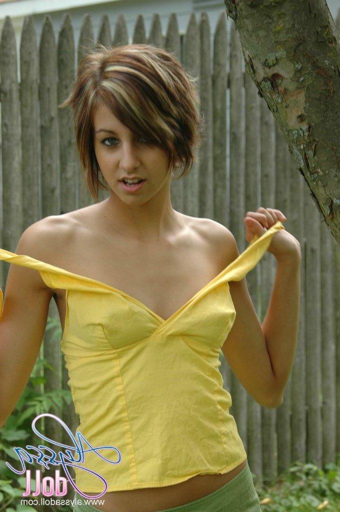 16P Pictures of Alyssa Doll exposing her small tits outside