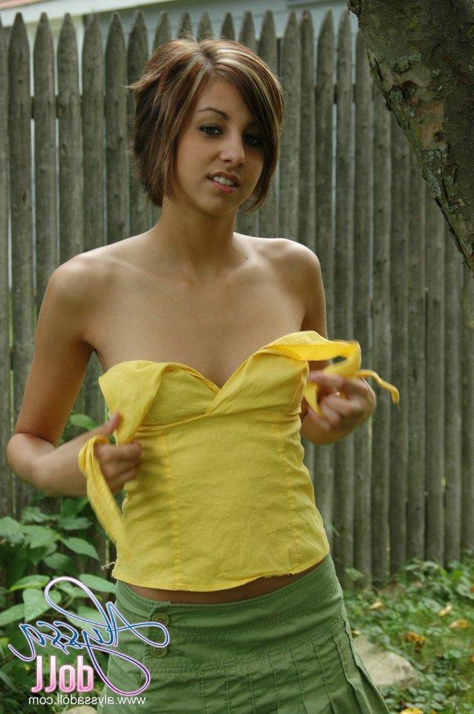 16P Pictures of Alyssa Doll exposing her small tits outside
