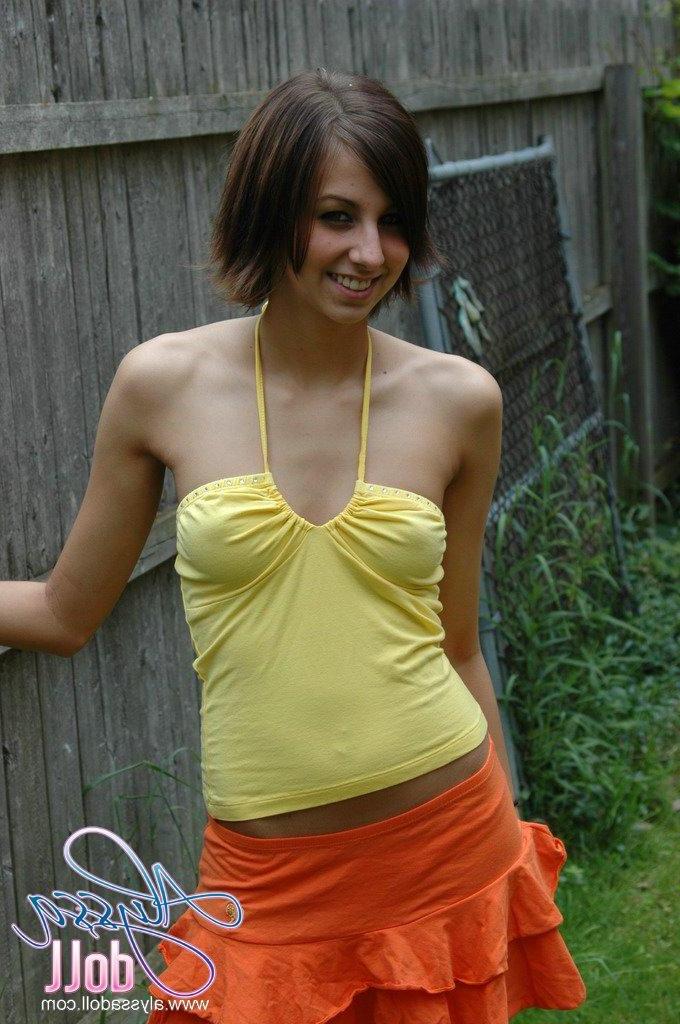 15P Pictures of Alyssa Doll flashing her perky tits outside