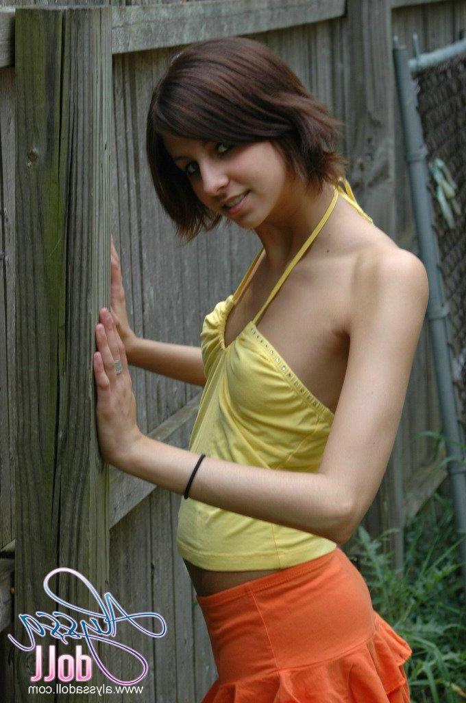 15P Pictures of Alyssa Doll flashing her perky tits outside