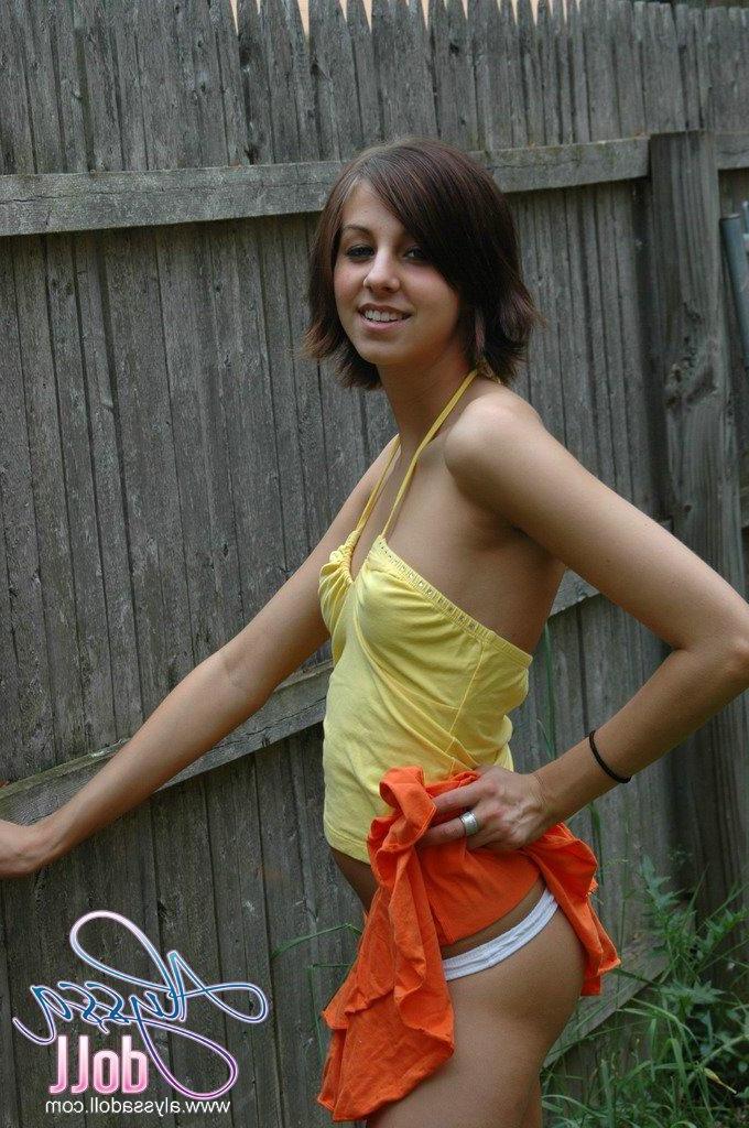 15P Pictures of Alyssa Doll flashing her perky tits outside