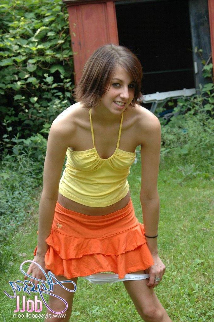 15P Pictures of Alyssa Doll flashing her perky tits outside