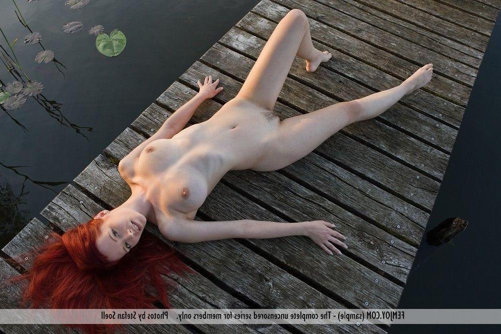 12P Pictures of redhead teen Ariel all naked on the dock