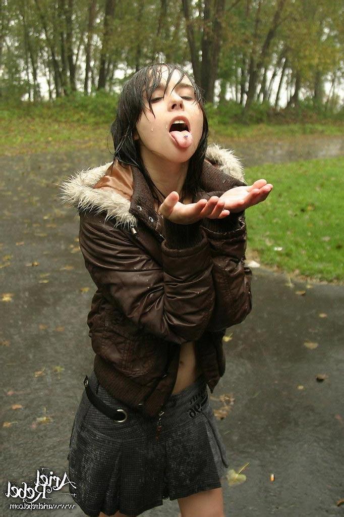 15P Pictures of Ariel Rebel flashing her small tits outside