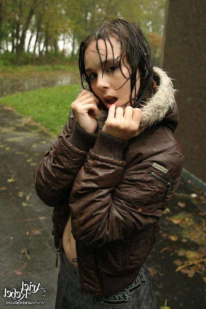 15P Pictures of Ariel Rebel flashing her small tits outside