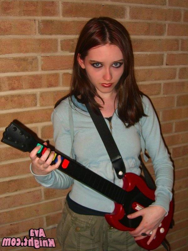 16P Pictures of Ava Knight playing guitar hero