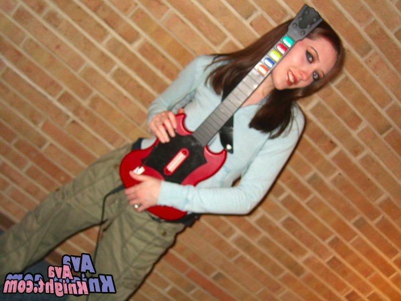 16P Pictures of Ava Knight playing guitar hero