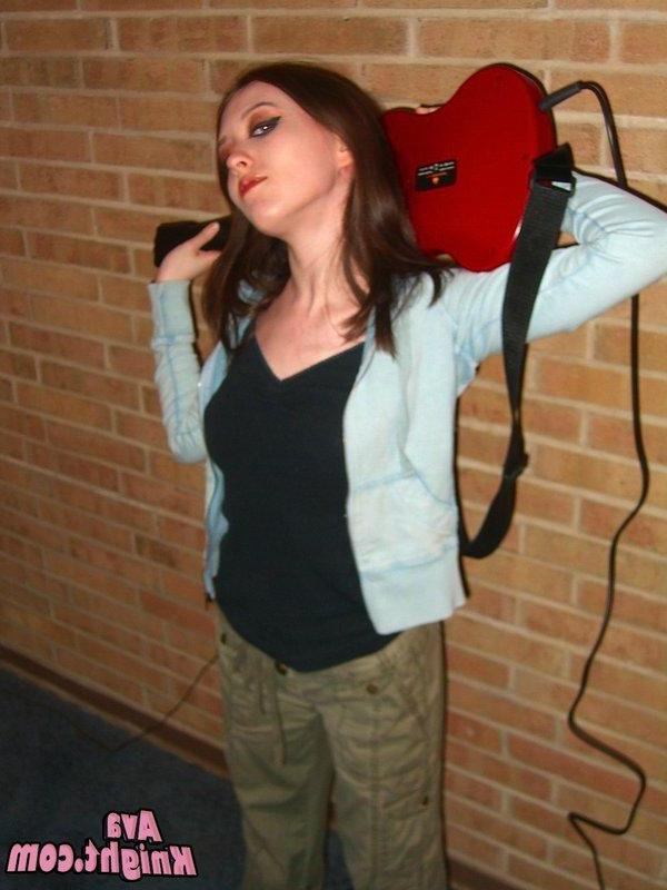 16P Pictures of Ava Knight playing guitar hero