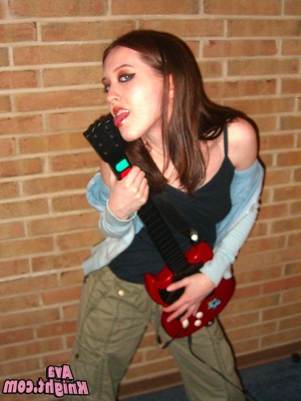 16P Pictures of Ava Knight playing guitar hero