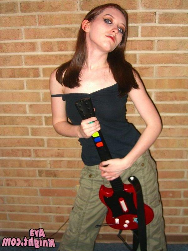 16P Pictures of Ava Knight playing guitar hero