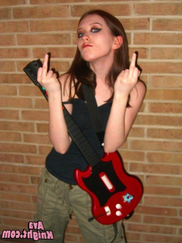16P Pictures of Ava Knight playing guitar hero