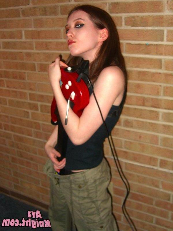 16P Pictures of Ava Knight playing guitar hero
