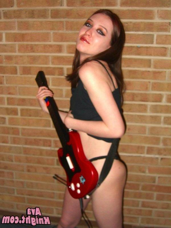 16P Pictures of Ava Knight playing guitar hero