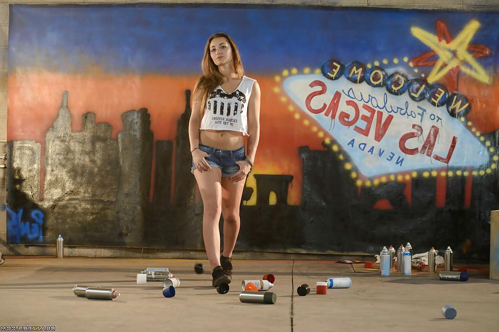 16P Frisky babe Dani Daniels undressing and exposing her seductive curves
