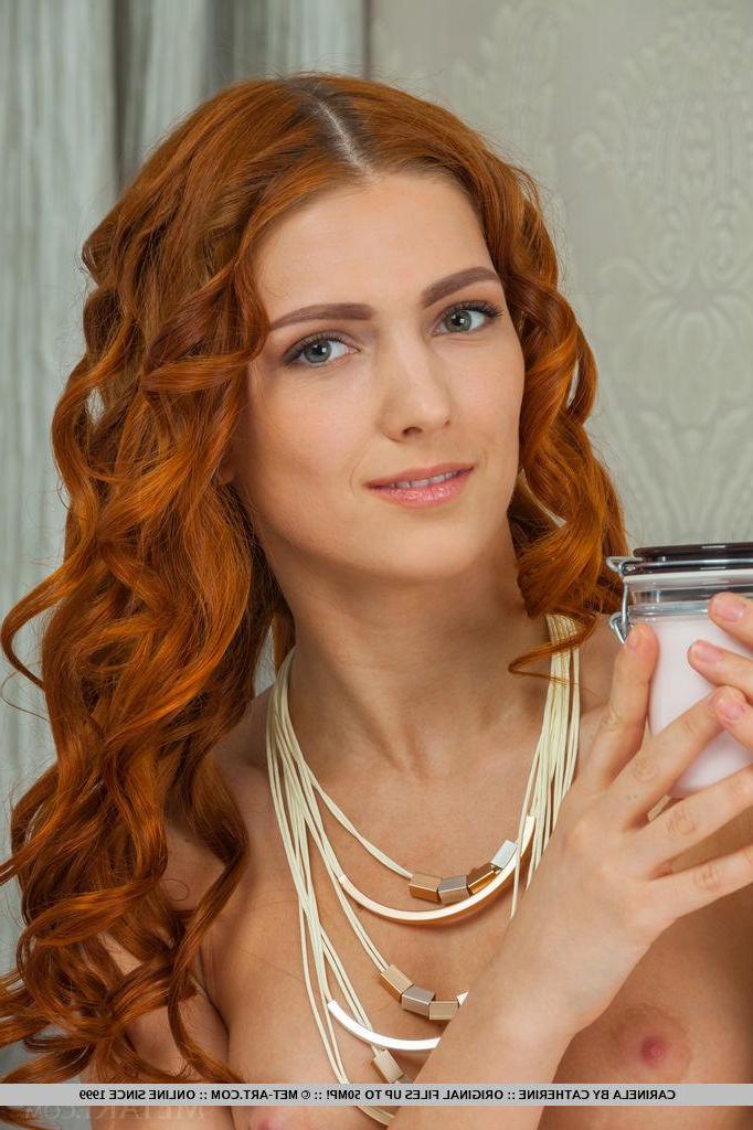 18P Redhead hottie Carinela gets naked for you in "Tarieg"