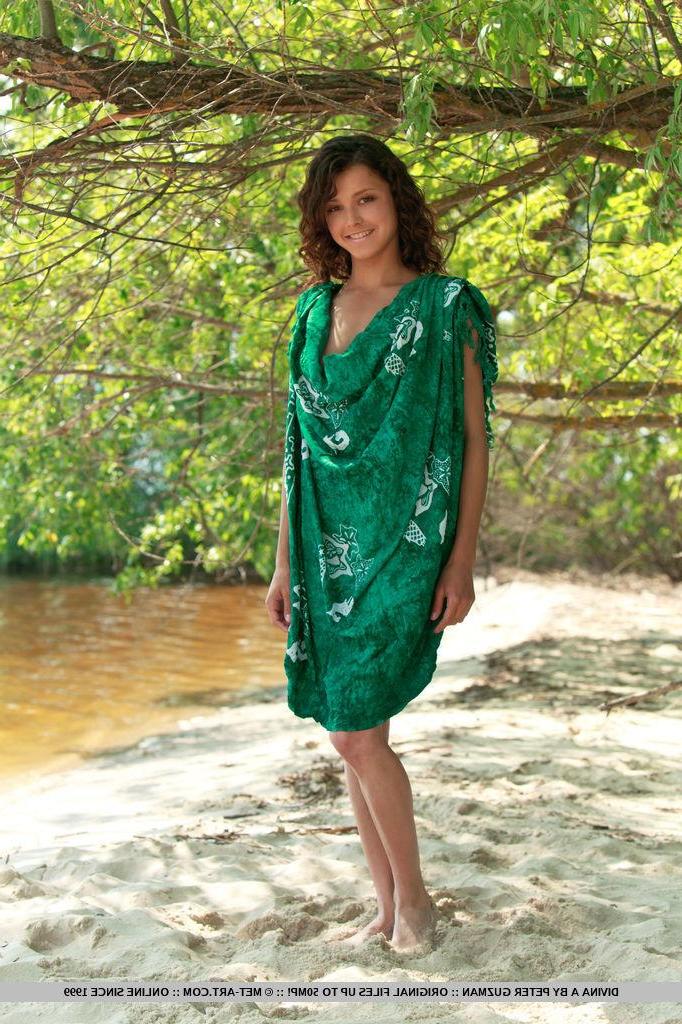 18P Brunette beauty Divina A poses her tight nude body in the forest