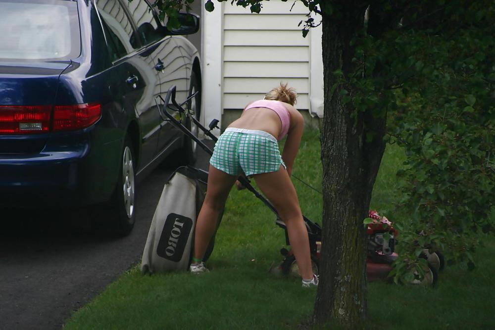 7P Neighbor mowing her lawn
