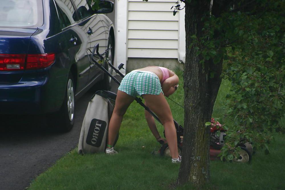 7P Neighbor mowing her lawn