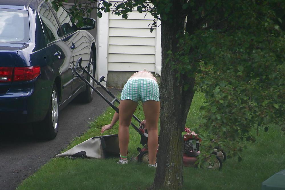 7P Neighbor mowing her lawn