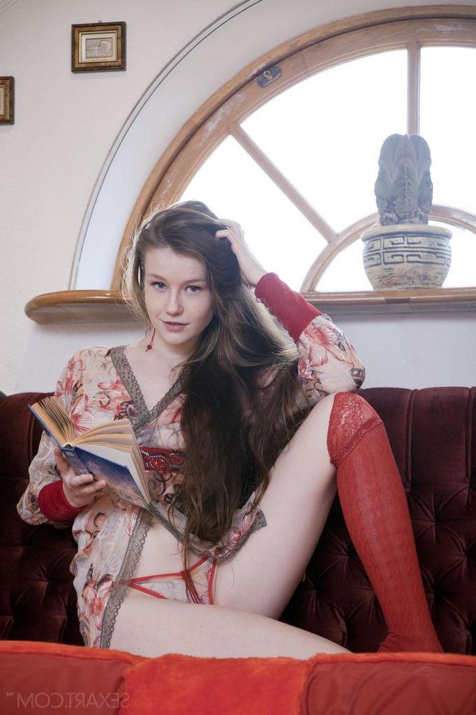 12P Brunette teen Emily Bloom spreads her legs in her socks in "Veux"