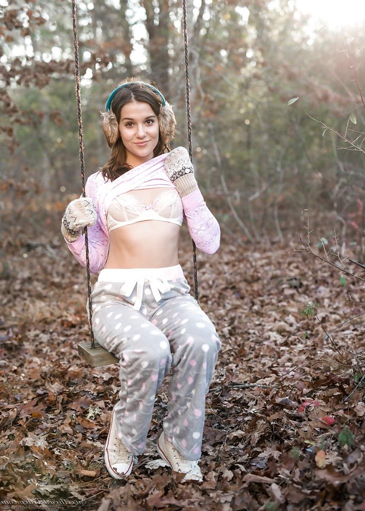16P Solo girl Kasey Warner undressing for nude shoot outdoors in woods clearing