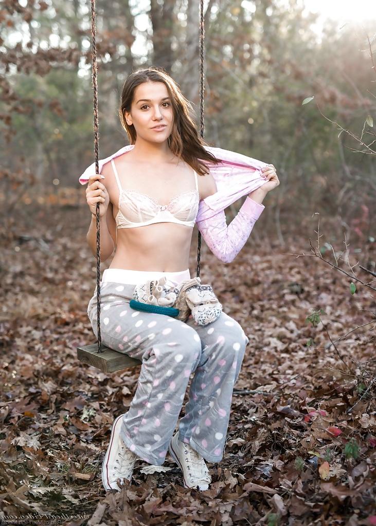 16P Solo girl Kasey Warner undressing for nude shoot outdoors in woods clearing