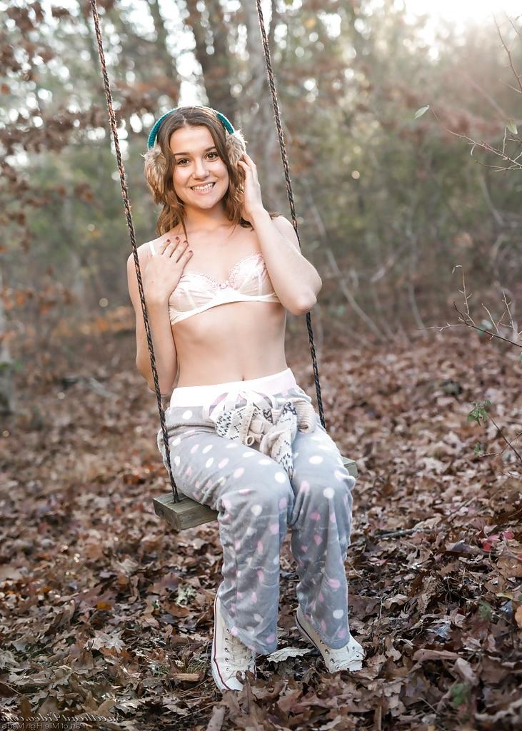 16P Solo girl Kasey Warner undressing for nude shoot outdoors in woods clearing