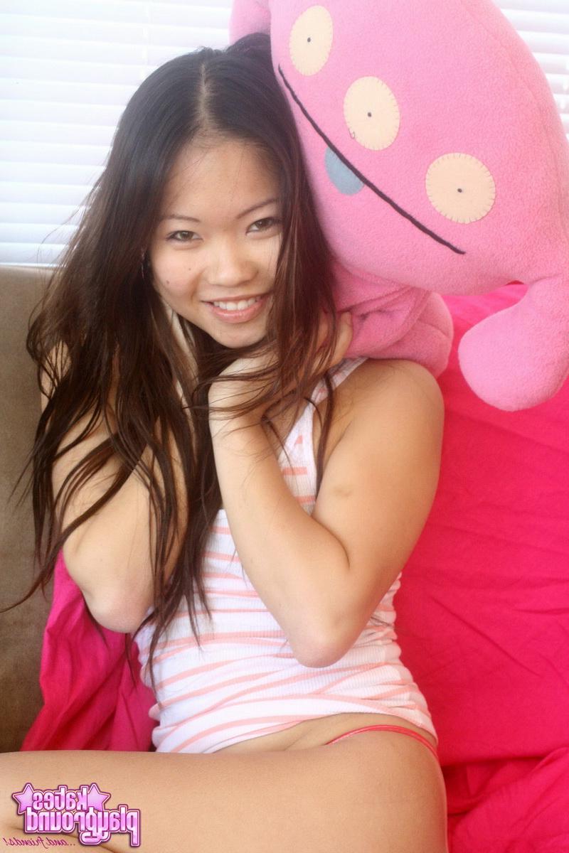 12P Asian cutie Grace teases with her tight little ass in a tiny red and pink thong