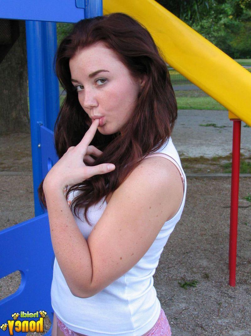 20P Pictures of teen cutie Heidi getting naughty in a park