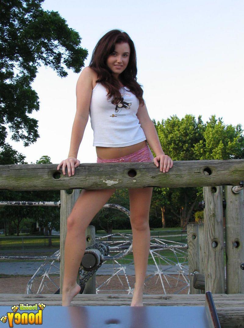20P Pictures of teen cutie Heidi getting naughty in a park