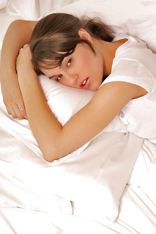 14P Gorgeous brunette teen wiggling on her bed