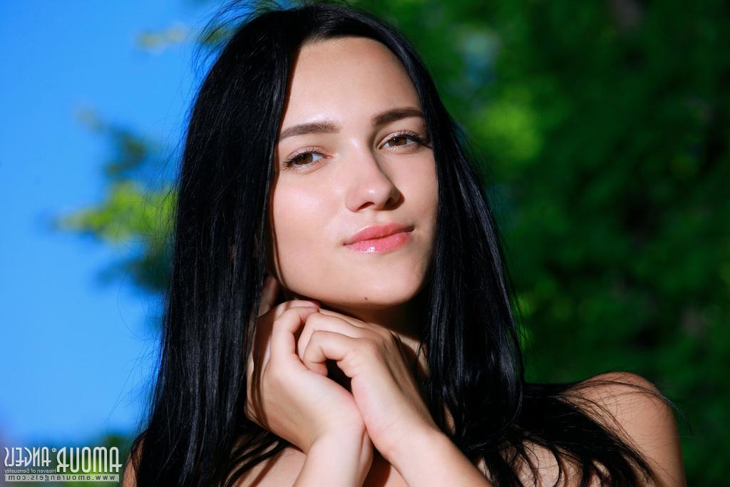 20P Brunette beauty Indiana Blanc gets naked for you by a tree