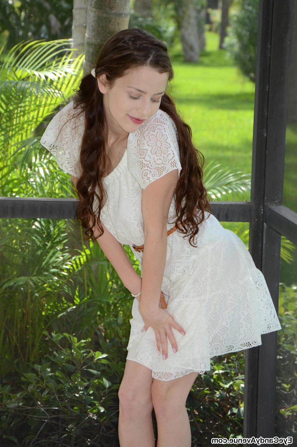 16P Brunette teen Iva Nora gets naughty outside on the lanai