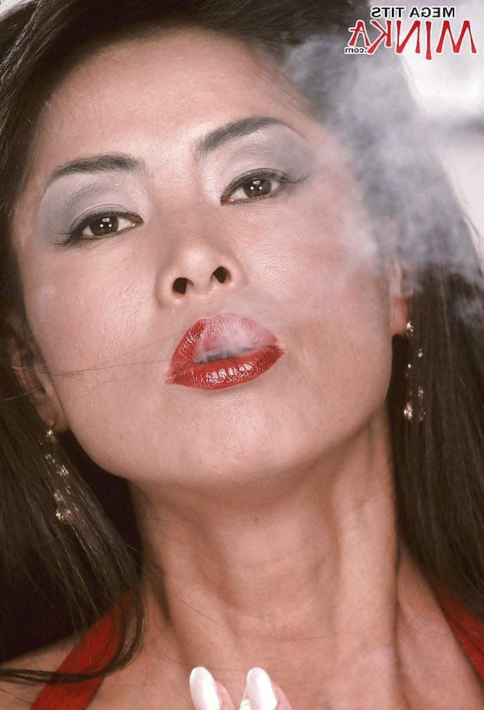 16P Mature Asian babe Minka flaunting monster tits and spreading hairy pussy