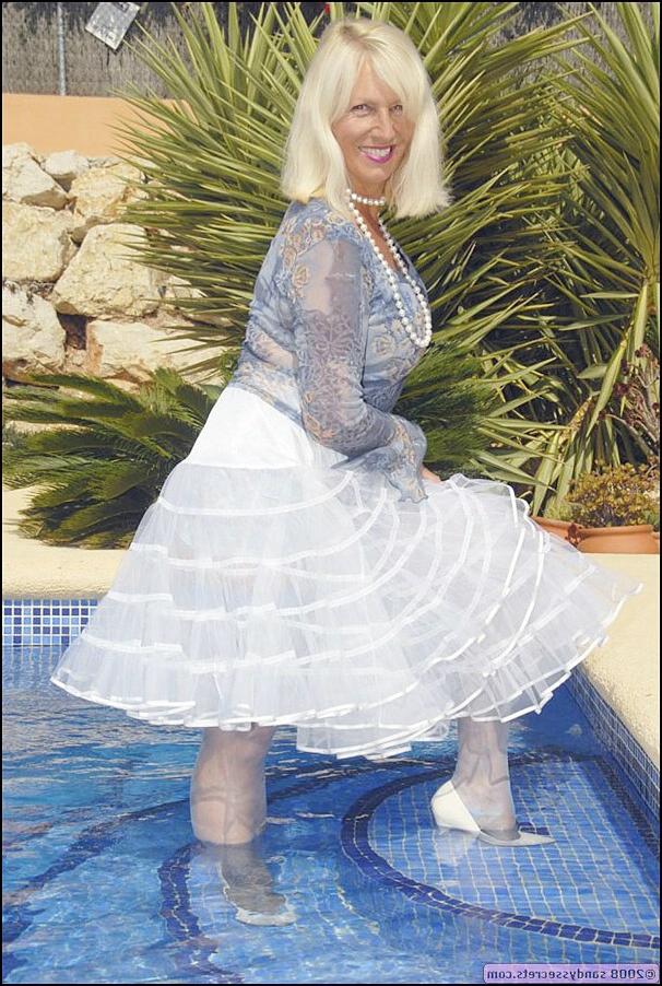 12P Mature bbw Sandy Spain splashing in the pool in nylon stockings and lingerie