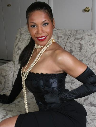 14P Ebony mature Semmie Desuora revealing her melons from a classy corset dress